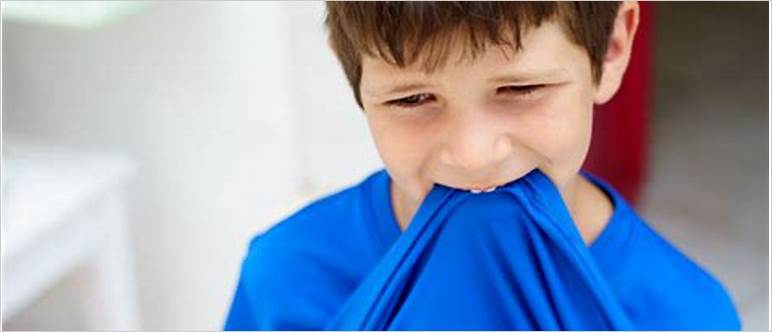 Child chewing on shirt